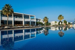 Swimming pool and restaurants at Theo Sunset Bay Hotel Paphos
