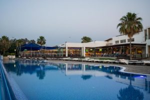 Pool and terrace at Theo Sunset Bay Hotel